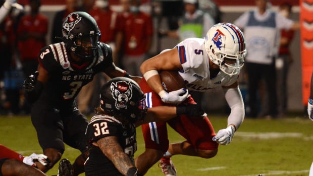 Louisiana Tech Bulldogs receiver Griffin Hebert (5) runs after a catch during the second half against the North Carolina State Wolfpack at Carter-Finley Stadium.